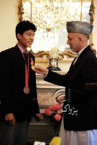Rohullah Nikpai receiving National Award from President Karzai